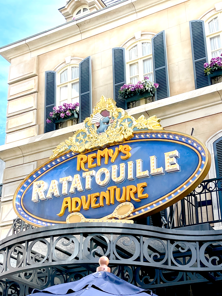 remys ratatouille adventure sign at epcot france pavilion