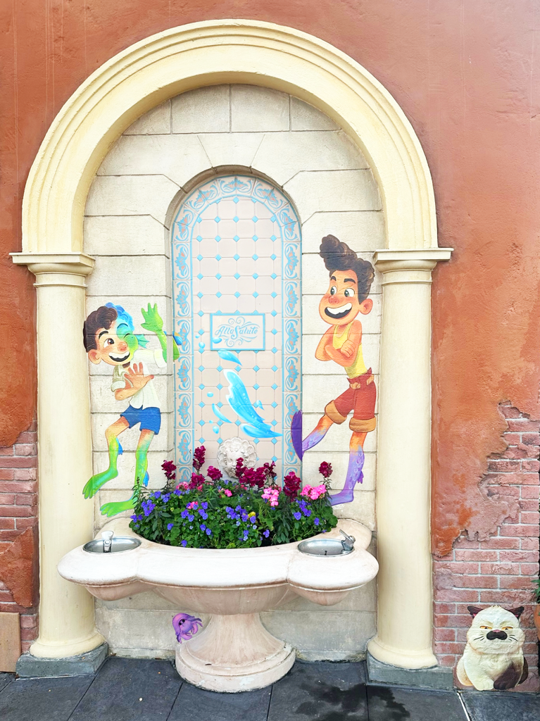luca painting on wall at italy pavilion in epcot at disney world