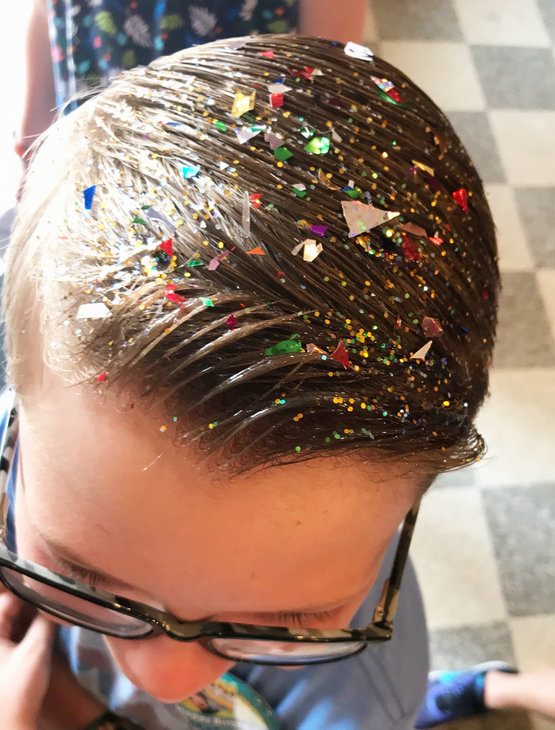 pixie dust in boy hair at magic kingdom disney world barber shop